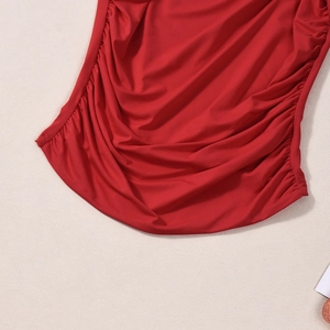 Detail of red square neck tank top with side ruching and elastic fabric texture