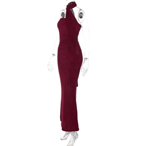 Detail of a dark red strapless maxi dress with elegant pleats and slim-fit silhouette