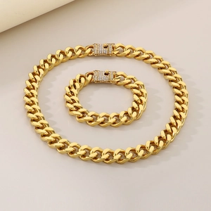 Detail of gold Cuban chain necklace and bracelet with CNC diamond-set buckle