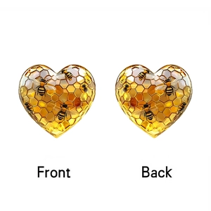 Detailed front and back views of heart-shaped acrylic ornament with honey bee and honeycomb