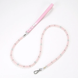 Detail of pink pearl pet leash with rhinestone beads and premium leather handle