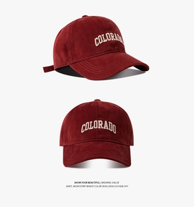 Detail view of burgundy cotton baseball cap with white Colorado embroidery at two angles