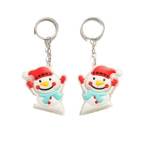 Cute cartoon snowman keychain pair with red hats and blue scarves on silver rings