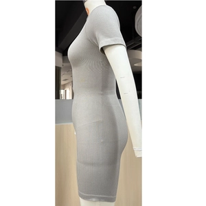 Close-up of seamless gray ribbed knit fabric texture on a slim-fit yoga bodysuit