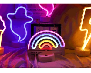 Detail of neon LED decorative lights including rainbow and lightning shapes with base