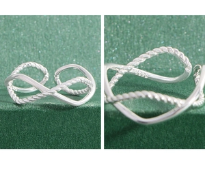 Macro shot of S925 sterling silver infinity ring with intricate braided rope texture
