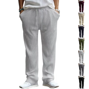 Detail view of vertical stripe knit fabric and color options for men's casual trousers