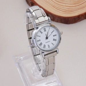 Detailed macro view of the stainless steel link watch band with a polished silver finish