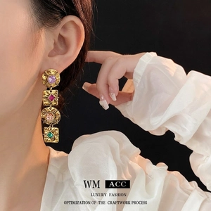 Vintage style long drop earrings with colorful gemstones and hammered gold finish