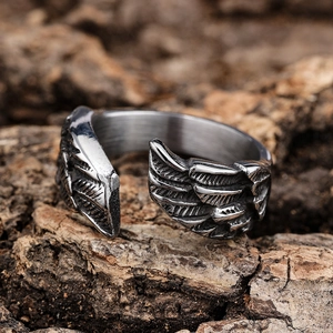 Vintage stainless steel open ring featuring detailed eagle feather wing carvings