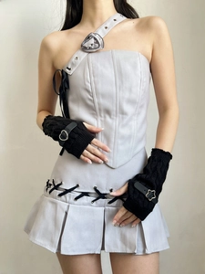 Detail of Y2K punk style black knitted fingerless gloves with decorative belt buckle feature