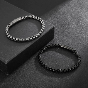 Detail of silver and black stainless steel box chain bracelets with magnetic cylindrical clasp
