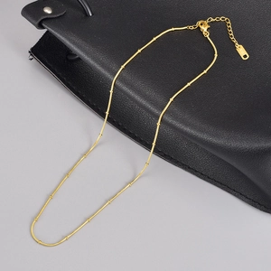 Minimalist 18K gold stainless steel snake bone necklace with small bead details