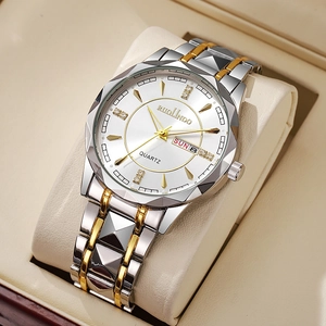 Detailed macro of men's watch dial featuring dual calendar display and diamond markers