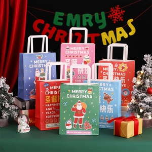 Close-up of colorful Christmas paper gift bags with Merry Christmas prints and holiday decor