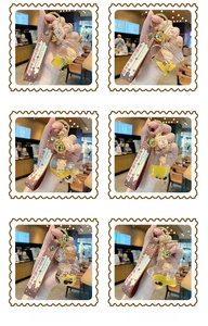 Detail view of six cute bear bubble tea liquid keychains with leather wrist straps