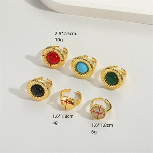 Minimalist gold ring set with turquoise and colorful gemstones in open-band designs