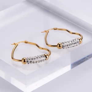Elegant gold heart-shaped hoop earrings with sparkling crystal accents for women