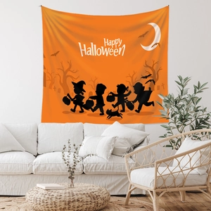 Detail view of Halloween tapestry featuring moon, bats and silhouettes on a white wall