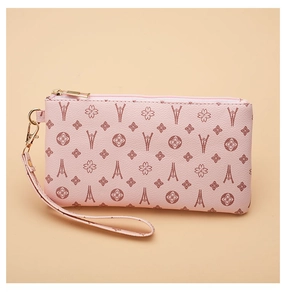 Pink PU leather clutch bag with embossed geometric patterns and a golden zipper detail