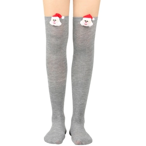 Detail of Christmas striped over-knee socks with festive Santa Claus plush doll attachment