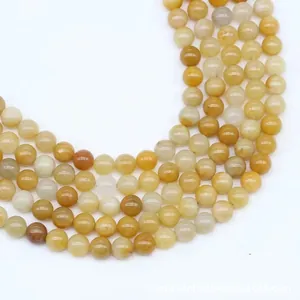 Detailed top view of natural yellow agate stone beads for DIY jewelry and accessory making