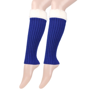 Detail of blue knitted leg warmers with white faux fur trim and cozy texture