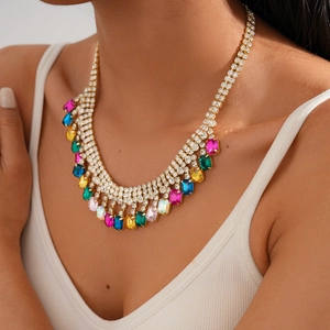 Detail of luxury multi-layer gold chain necklace with colorful crystal gemstones