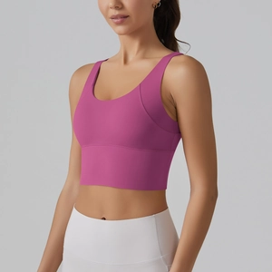 Detail of high-impact V-shaped back sports bra in deep pink with premium texture