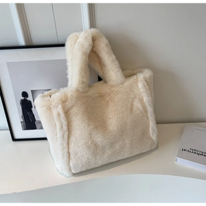 Close-up of fluffy faux fur tote bag in cream white showing soft plush texture and large capacity