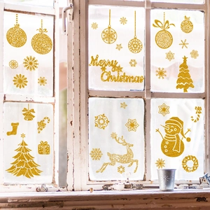 Glittery gold Christmas window stickers with Santa and reindeer on rustic white wood frame