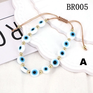Adjustable evil eye charm bracelet with blue beads and light brown woven cord