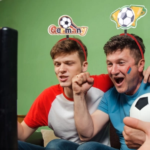 German football themed fan headbands with soccer ball and trophy party decorations
