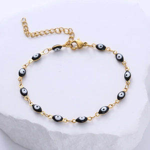 Golden stainless steel chain bracelet with colorful oval evil eye charms and lobster clasp