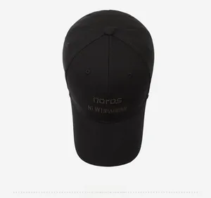 Detail view of the embroidered logo on a black canvas baseball cap for men