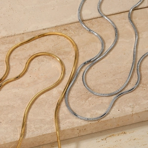 Minimalist double layered snake chain necklaces in polished gold and silver finishes