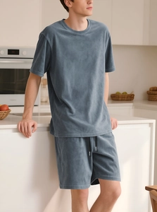 Close-up of soft velvet texture on dark grey-blue men's lounge set with drawstring