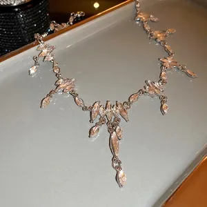 Exaggerated silver-tone marquise rhinestone necklace with fringe tassel details