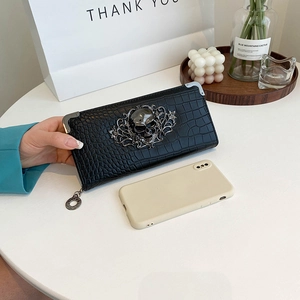 Long black crocodile pattern wallet with skull ornament and metal corners in gothic style
