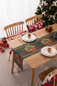 Festive Christmas table runner with wreath, red bow and Merry Christmas text detail