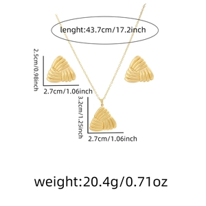 Detail view of golden necklace and earrings set with layered triangle texture and dimensions