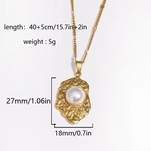 Detail view of 18K gold flower shell pendant with pearl and exact size measurements