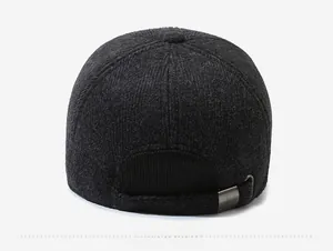 Detail of wool blend winter cap featuring a vintage metal adjustable strap at the back