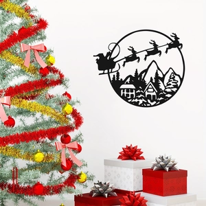 Black Christmas metal silhouette showing Santa Claus over snowy mountains on wall