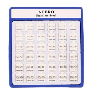 Set of 36 pairs of stainless steel stud earrings with clear zircon on a display stand