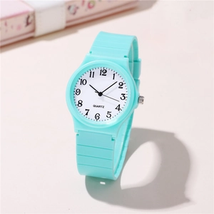 Minimalist mint green quartz watch with silicone strap and easy-to-read numeric dial
