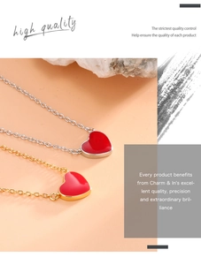 Detail of gold and silver heart necklaces with temperature-sensitive red enamel charms
