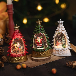Christmas tree snow globes with Santa and snowman motifs featuring light-up resin base