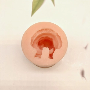 Detailed top view of pink silicone mold for sitting Santa Claus candle making