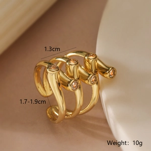 Detail shot of three-piece 18K gold plated ring set with amber zircon and size annotations